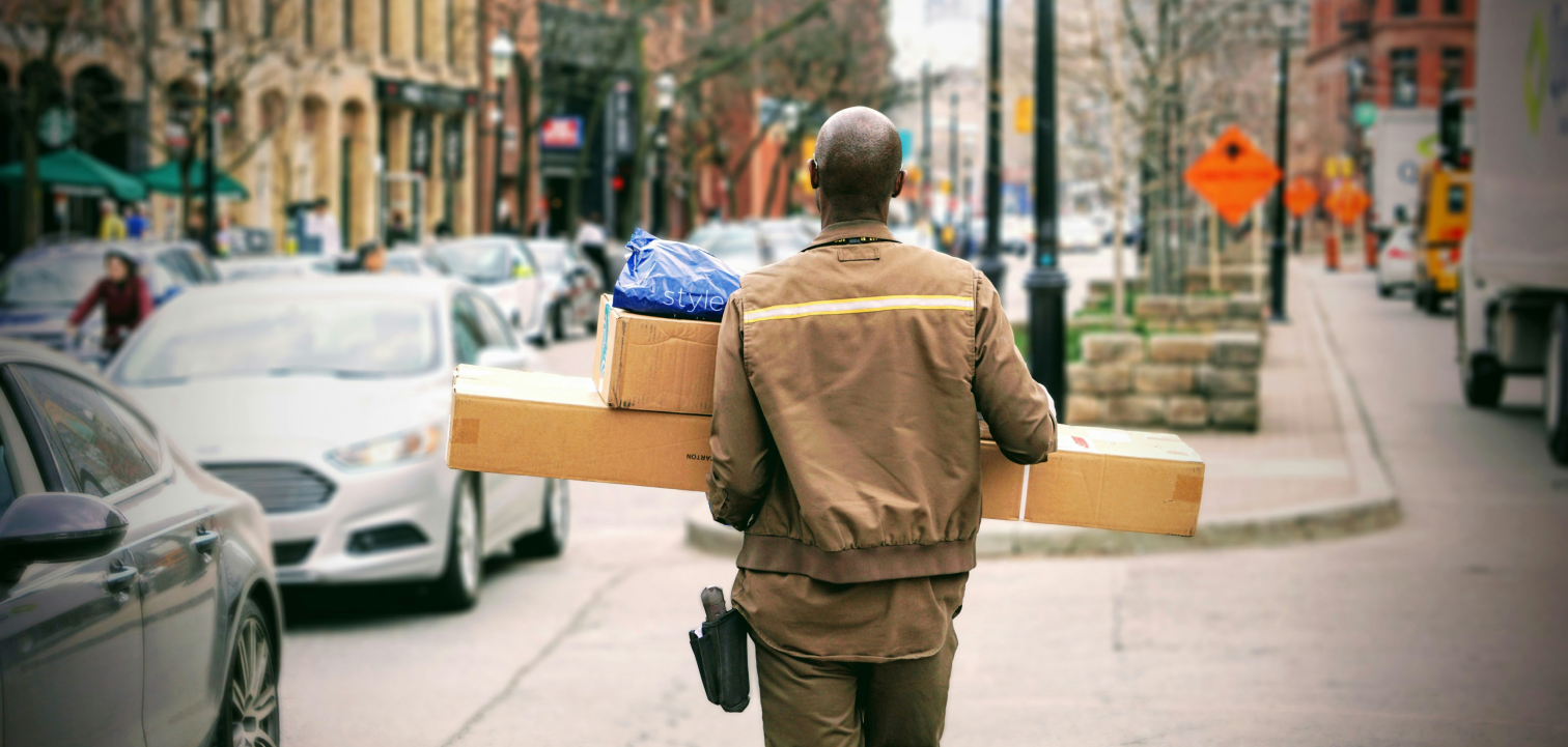 Delivery person carrying packages